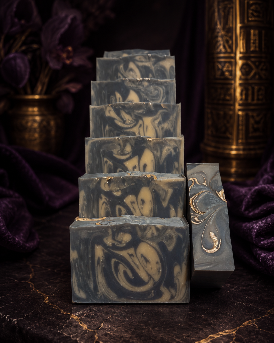 Stacked artisan soap bars with deep purple and cream swirls on dark wood, purple velvet and gold decor in moody aesthetic photo
